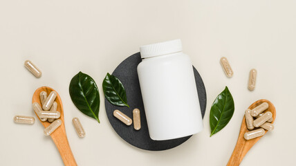 Top view mockup bottle of herbal vitamins or pills with green leaves, bio supplement, banner size