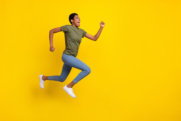 Fototapeta na wymiar Full body portrait of crazy excited person look empty space jump rush isolated on yellow color background