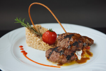 Meatballs And Rice Wih Sauce On White Plate Turkish Dish