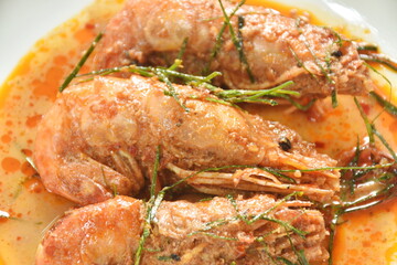 spicy stir fried river shrimp with slice grass leaf curry on plate 