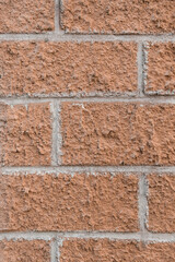 Brown brick vertical wall texture old stone background masonry