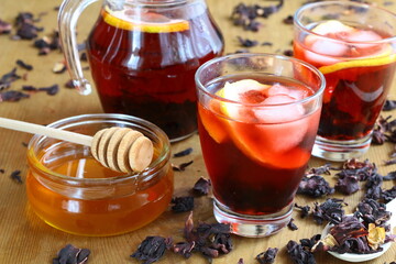 Dried hibiscus flower drink with lemon, honey and ice