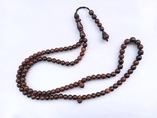 prayer beads or rosaries isolated on a white background