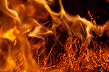 Close up photo of flames. Sparks from the bonfire