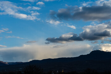 Beautiful dramatic sky over valley hills