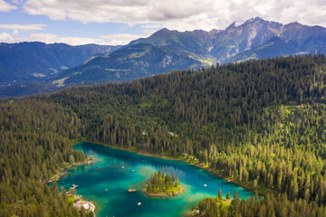 Obraz na płótnie Canvas Aerial view of Caumer Lake in Graubrunden canton late afternoon, flims, Graubunden, Switzerland