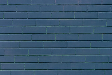 Blue dark paint brick wall of interior facade texture abstract background