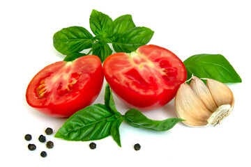 Slices of tomatoes, basil, garlic, black pepper isolated on white background