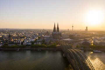 Fototapeta na wymiar View of Cologne, the Rhine river and Cathedral by sunset