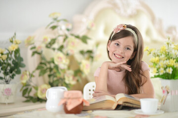 Young girl reading interesting big book