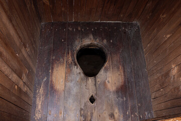 rustic wooden toilet, close-up
