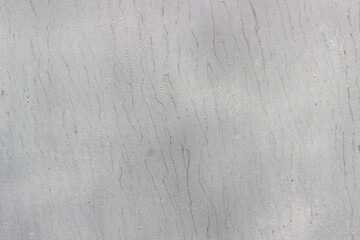 painted white sheet of metal, textured light background