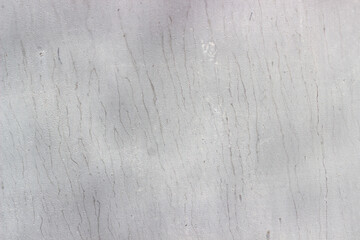 painted white sheet of metal, textured light background