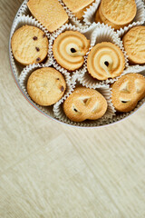 Top view tasty danish butter cookies in a tin box , set of crispy shortbread biscuits, baked pastry, sweet food, space for text.