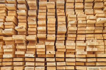 Edged board in stacks. Natural background. Texture.