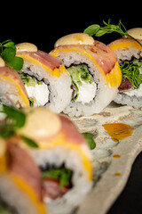 creative sushi on the black stone