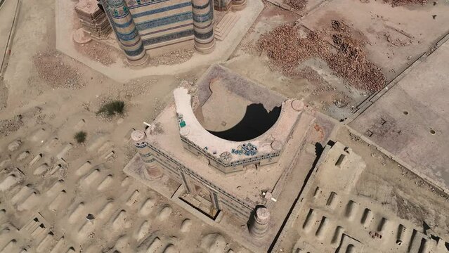 A cinematic view of Uch Sharif Jawindi Bibi Tomb picturesque view on a sunny blue sky day