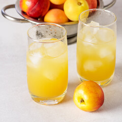 Delicious Peach Lemonade made with Soda Water on Gray Background Tasty Beverage Square