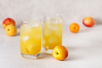 Delicious Peach Lemonade made with Soda Water on Gray Background Tasty Beverage Copy Space