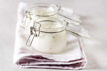 Yogurt in Glass Jar on Linen Napkin White Yoghurt Tasty and Healthy Breakfast Horizontal