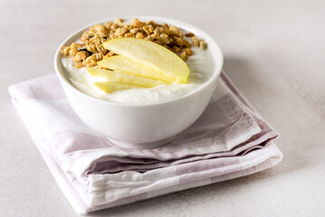 Yogurt With Granola and Raw Bowl in a White Bowl Healthy Breakfast Horizontal