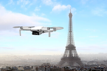 Drone with 4k digital camera flying over Paris city with Eiffel tower at the background in Paris,...