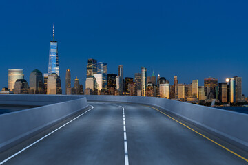 Obraz premium Empty urban asphalt road exterior with city buildings background. New modern highway concrete construction. Concept of way to success. Transportation logistic industry fast delivery. New York. USA.