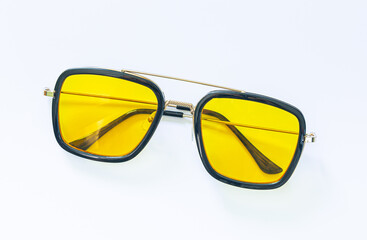 yellow sunglasses on a white background,Anti-glare glasses for the driver in a metal frame with yellow glasses on white background.