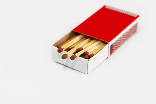 wooden yellow matches with sulfur for ignition in a paper box