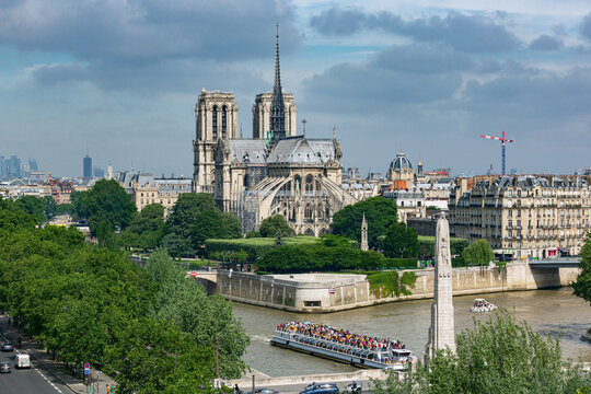 aerial view of Notre Dame de Paris Cathedral. Crowded ship on River Seine