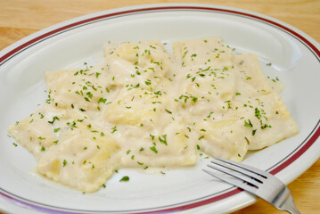 Cheesy Ravioli with a Parmesan Alfredo Sauce