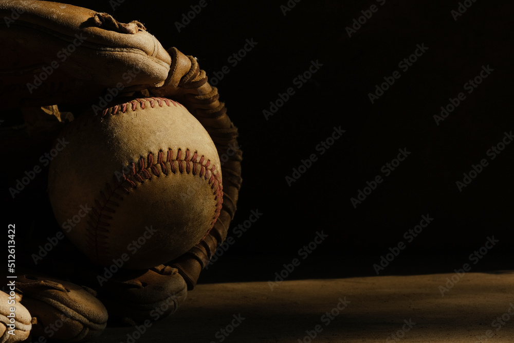 Poster old baseball glove with ball on black background with copy space for sports banner. - Posters