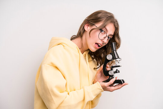 teenager girl. scientist student with a microscope - Powered by Adobe