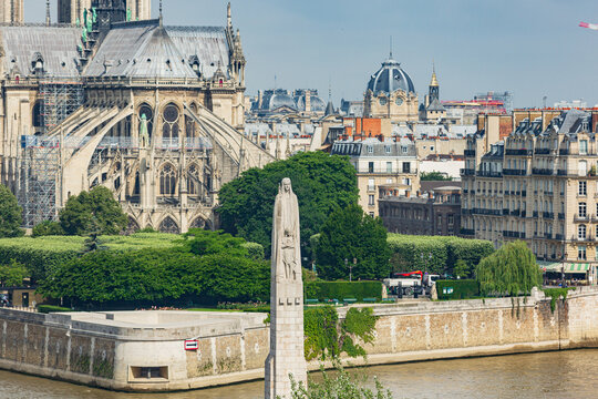Aerial view of the Statue of Saint Genevieve with Paris in the background