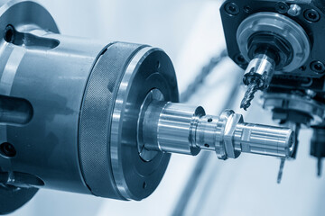 The multi-tasking CNC lathe machine swiss-type milling cut the metal parts by milling spindle.