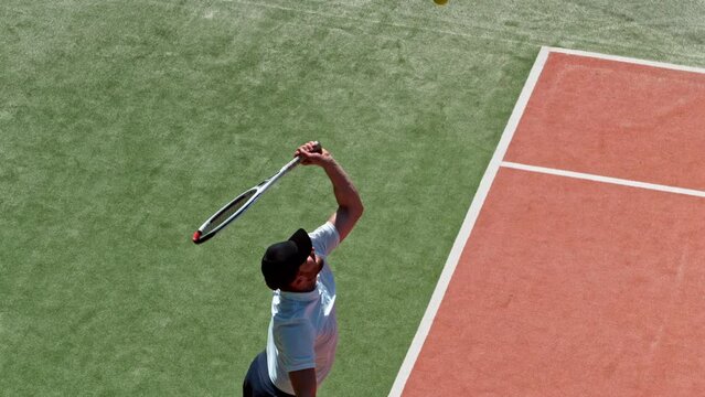 Super slow motion of tennis player hitting the ball in service. Filmed on high speed cinema camera, 1000fps.