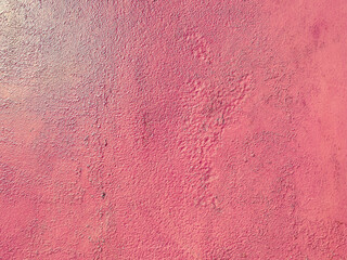 pink, matte, bright texture. the wall is unevenly painted pink. coating on the wall. 3d texture, background