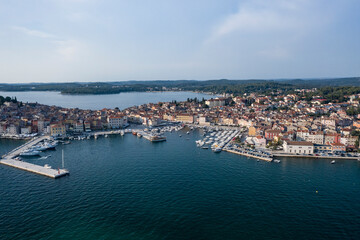 Naklejka na ściany i meble Aerial view of the coastline of Rovinj old city with the old port of Rovinj in summer, Croatia