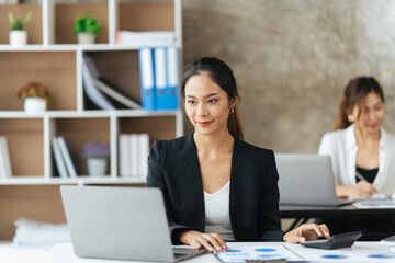 Young Confident Businesswoman Using Desktop Computer in Modern Office with Colleagues. Stylish Beautiful Manager Working on Commercial, Financial and Marketing Projects.