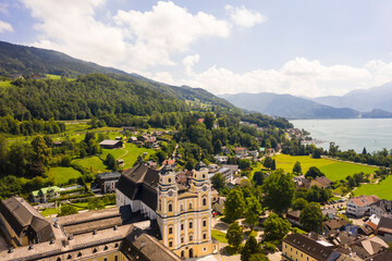 Aerial of Mondsee village with Basilika saint Michael on the lake, Mondsee, Upper Austria, Austria