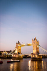 Tower Bridge and the River Thames, London. A dusk view over the Thames with the iconic Tower Bridge landmark dominating the scene. - 512623470