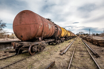 Fototapeta na wymiar Set of tanks with oil and fuel transport by rail.