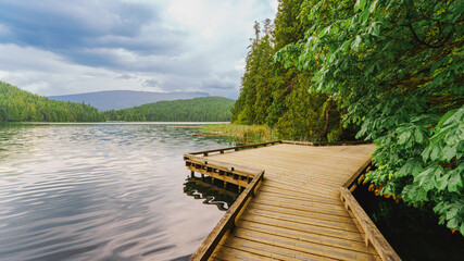 Wooden viewing platform on Sasamat Lake just off Sasamat Loop forest trail, BC
