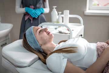 woman waiting for skin cleansing procedure at beautician
