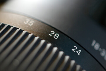 Closeup of the zoom ring on the camera lens with numbers