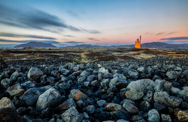 Fototapeta na wymiar Hopsnes Lighthouse on Icelands south coast during sunset.Near the town of Grindavik.
