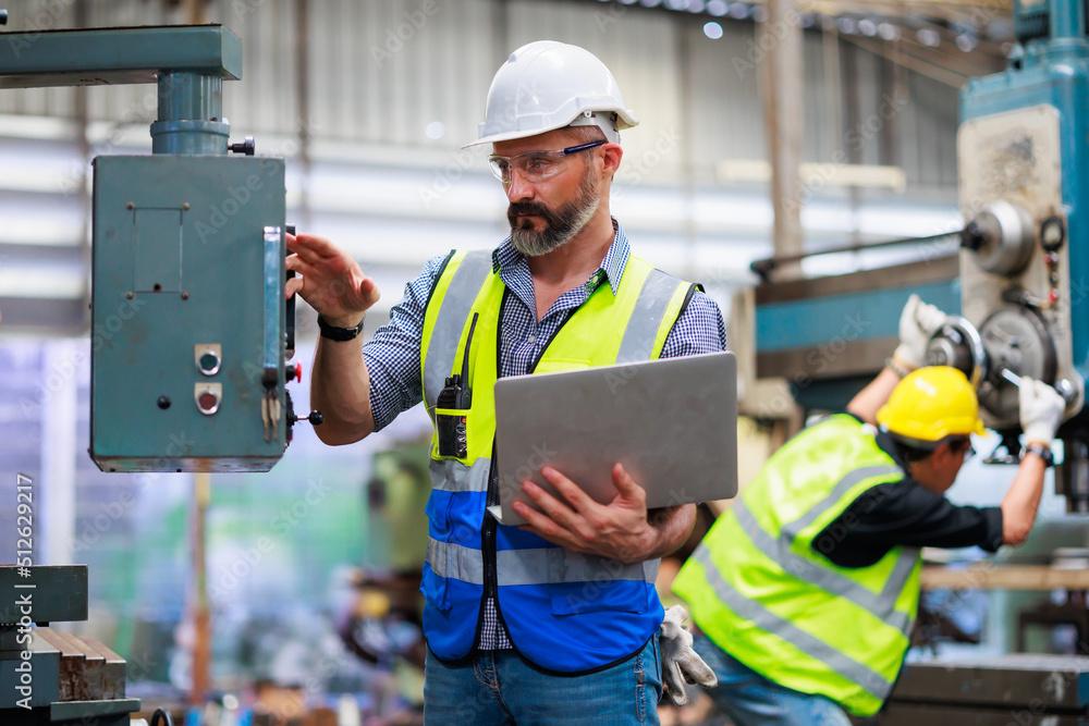 Poster Portrait Caucasian professional Engineer factory. Engineering working with team and digital tablet computer in safety hardhat at factory industrial facilities. Heavy Industry Manufacturing Factory