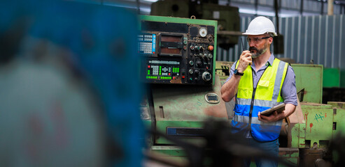 walkie talkie. Portrait Caucasian professional Engineer factory. Engineering worker in safety...