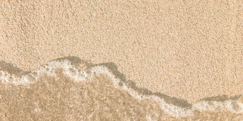 sand on the beach with wave