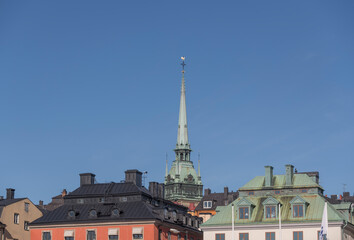 Roofs and the tower of the German church Tyska Kyrkan a summer day in Stockholm